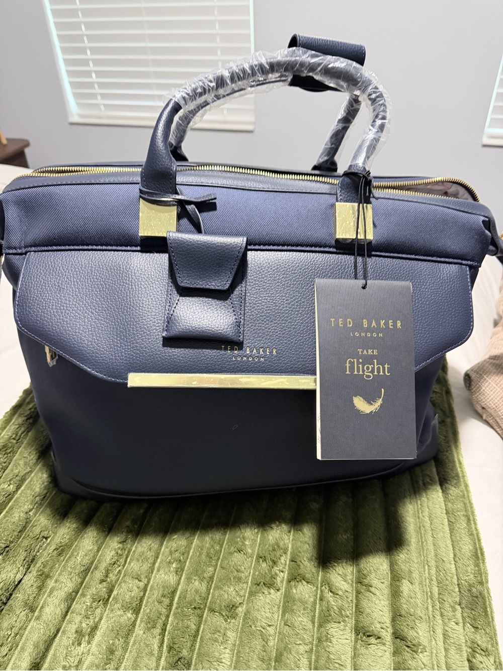 Ted Baker navy travel tote with gold accents